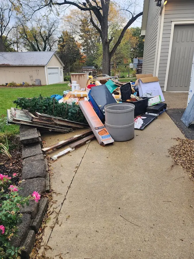 Dumpster being loaded with debris for Roofing Dumpster Rental in Solana Beach